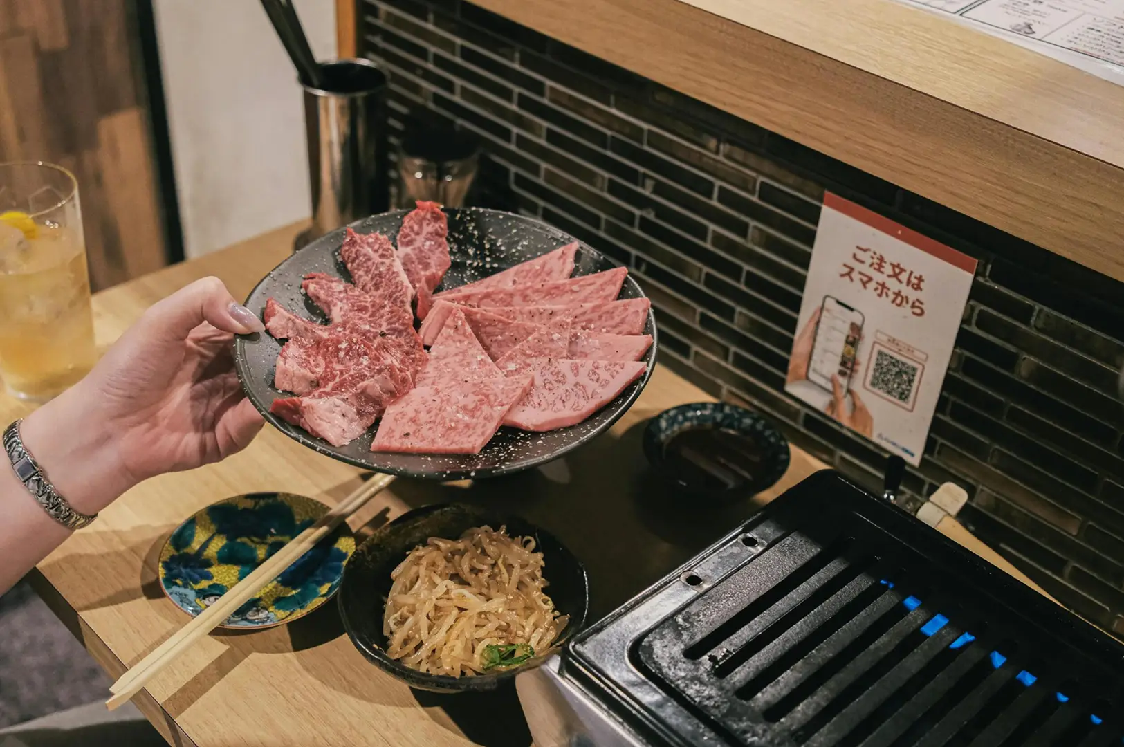 Raw wagyu beef cuts on a plate ready for yakiniku grilling at Best Izakaya Singapore
