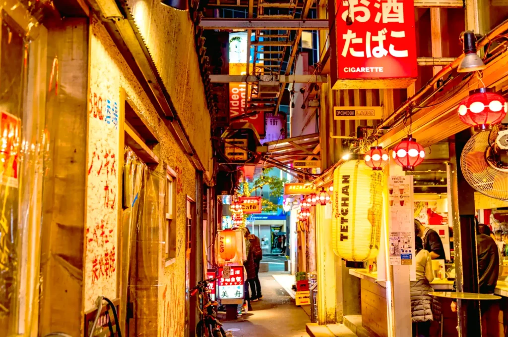 Shinya Izakaya Through the Eyes of a Regular: Rituals, Conversations, and Midnight Bowls It is 11:30 PM on a Thursday, and the city outside begins its uneven descent into sleep. The traffic on the main road fades into a rhythmic hush, punctuated only by the occasional motorbike. But inside Shinya Izakaya, located at 79 Boat Quay Singapore 049867, the air is thick with steam, the scent of grilled dishes, and the low murmur of those with nowhere else to be. I slide the door open with a familiar rattle. A nod from the chef signals my arrival. My seat, third from the left near the grilling station, is ready as always. There’s no need for a menu—though Shinya offers an extensive one featuring everything from fresh sashimi platters, including buttery salmon, to juicy grilled yellowtail collar (kama shioyaki). A cold oshibori towel lands next to my hand, and a glass of aged sake, including the renowned Hokkaido Kanjyuku variety, from their carefully curated selection is poured before I settle into my chair. Here, the night doesn’t end; it simply changes tempo. The izakaya’s charm is rooted not just in the food but in the rhythm it creates. Shinya Izakaya: Hokkaido Kanjyuku Stewed Pork Belly and Rituals That Anchor Us At the heart of Shinya Izakaya is its menu, which balances comfort and flavour. One of the most iconic dishes is the stewed pork belly—a tender, slow-cooked dish that melts in your mouth, the perfect pairing to a glass of sake. The richness of the meat, with its delicate fats and seasoned sauce, creates a savory-sweet harmony that regulars swear by. The menu at Shinya caters to all tastes, offering stir-fried dishes, deep fried dishes, and grilled skewers. The charred edges of dishes like enoki bacon and grilled yellowtail collar release a smokiness that fills the small space with irresistible aroma. For lighter appetites, the fresh and assorted sashimi brings the ocean straight to your plate, featuring tai, salmon, and premium cuts like otoro, which provide a nice buttery texture and melt-in-the-mouth experience. The rituals here go beyond food. Regulars have their routines: the "last train" glance around 11:45 PM, the chef stepping out to pour a drink for a familiar face, or the universal devotion to a final rice dish—whether it’s a comforting ochazuke or fried rice bursting with flavour. It’s these moments that anchor us in a fast-paced city. 79 Boat Quay: A New Izakaya Version in the Middle of Singapore Located at 79 Boat Quay, Singapore 049867, Shinya Izakaya brings authentic izakaya culture to the bustling Boat Quay area. Compared to the rows of generic dining options nearby, Shinya stands out as a rejuvenated space for those seeking intimacy, depth, and excellent food. What makes this izakaya sushi restaurant unique isn’t just its charm but its versatility. Whether you’re enjoying a lively night in one of the private rooms or seated at the counter watching skewers of meat and vegetables char over the grill, Shinya offers a tailored experience. Its unassuming interior, with warm wood accents and lanterns, creates an atmosphere that feels both nostalgic and inviting—a rare find in the Boat Quay area. The Quiet Language of Regulars at the Table To be a regular at a place like Shinya is to participate in an unspoken ritual. Staff remember your preferences: perhaps the assorted sashimi platter, followed by a bowl of kanjyuku stewed pork belly dish, and ending with a hot bowl of rice. These small gestures transform the dining experience into something deeply moving and personal. Shinya embraces the Japanese concept of omotenashi, where hospitality is intuitive. The chef’s anticipation of your needs—whether it’s a refill of sake or a platter of perfectly seasoned appetisers—creates a sense of connection that goes beyond the transactional. Late-Night Conversations and the Essence of Nomunication After dark, under Shinya Izakaya’s warm lantern glow, conversations flow freely. Known for the Japanese term nomunication (a blend of drinking and communication), the counter here acts as a confessional. Business deals are sealed over shared skewers, and life stories unfold alongside bowls of simmered vegetables and hot soup. But just as often, the interaction is wordless. A companionable silence grows between diners, punctuated by the crunch of cucumber or the hearty slurp of noodles. Even those visiting for the first time quickly match the room’s calm energy, finding themselves drawn into its rhythm. Food as a Companion: Types of Dishes Served At Shinya, food is not a performance but a quiet companion to your evening. The dishes arrive in no particular order, each seasoned to stand up to drinks like sake and beer. From the sweetness and delicate flavour of grilled dishes to the chewy, satisfying texture of deep fried dishes, every bite feels intentional. The juicy meats, charred skewers, and bowls of hot rice all work together to support the flow of the night. The midnight bowl remains the highlight. Whether you opt for ramen, ochazuke, or a small rice dish, this final meal closes the evening like a punctuation mark. It grounds you, warming both body and spirit before you step back into the night air of Boat Quay. Why Shinya Izakaya Represents More Than Just a Meal In a city like Singapore, dining often feels like a race for the newest trend. But Shinya Izakaya offers a steady alternative. The restaurant prioritizes connection over novelty. That same spirit of authenticity can also be seen at places like The Public Izakaya, where the experience revolves around food, drinks, and the atmosphere between them. The Bottle Keep system, where regulars store their aged sake for future visits, is just one example of how Shinya fosters loyalty. The chef’s handwritten menu and the worn wood of the counter reflect an authenticity that’s hard to replicate. Shinya is not just a place to eat; it’s a place to find rhythm. The regulars, the rituals, the carefully seasoned dishes—all combine to create a space that feels deeply human. The Evening’s Closing Note The check arrives without ceremony. The chef nods as I leave, a silent promise that I’ll return. Walking out of Shinya Izakaya into the humid Singapore night, I feel lighter, more grounded, and quietly moved. For those seeking both comfort and connection, Shinya is a sanctuary. Whether it’s your first visit or your fiftieth, you’ll find more than just good food—you’ll find a rhythm, a ritual, and a reason to return. If you’re exploring more places like Shinya, our curated list of the best izakayas in Singapore highlights some of the city’s most memorable late-night dining spots.