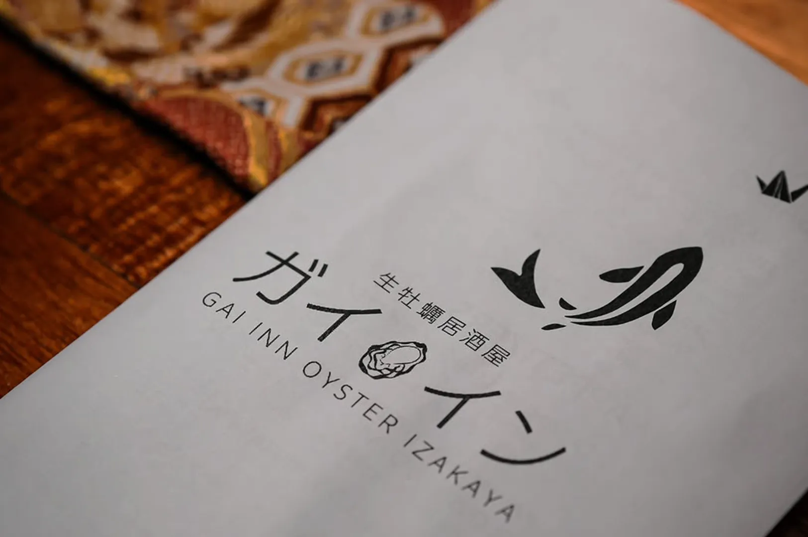 Gai Inn Oyster Izakaya menu on restaurant table