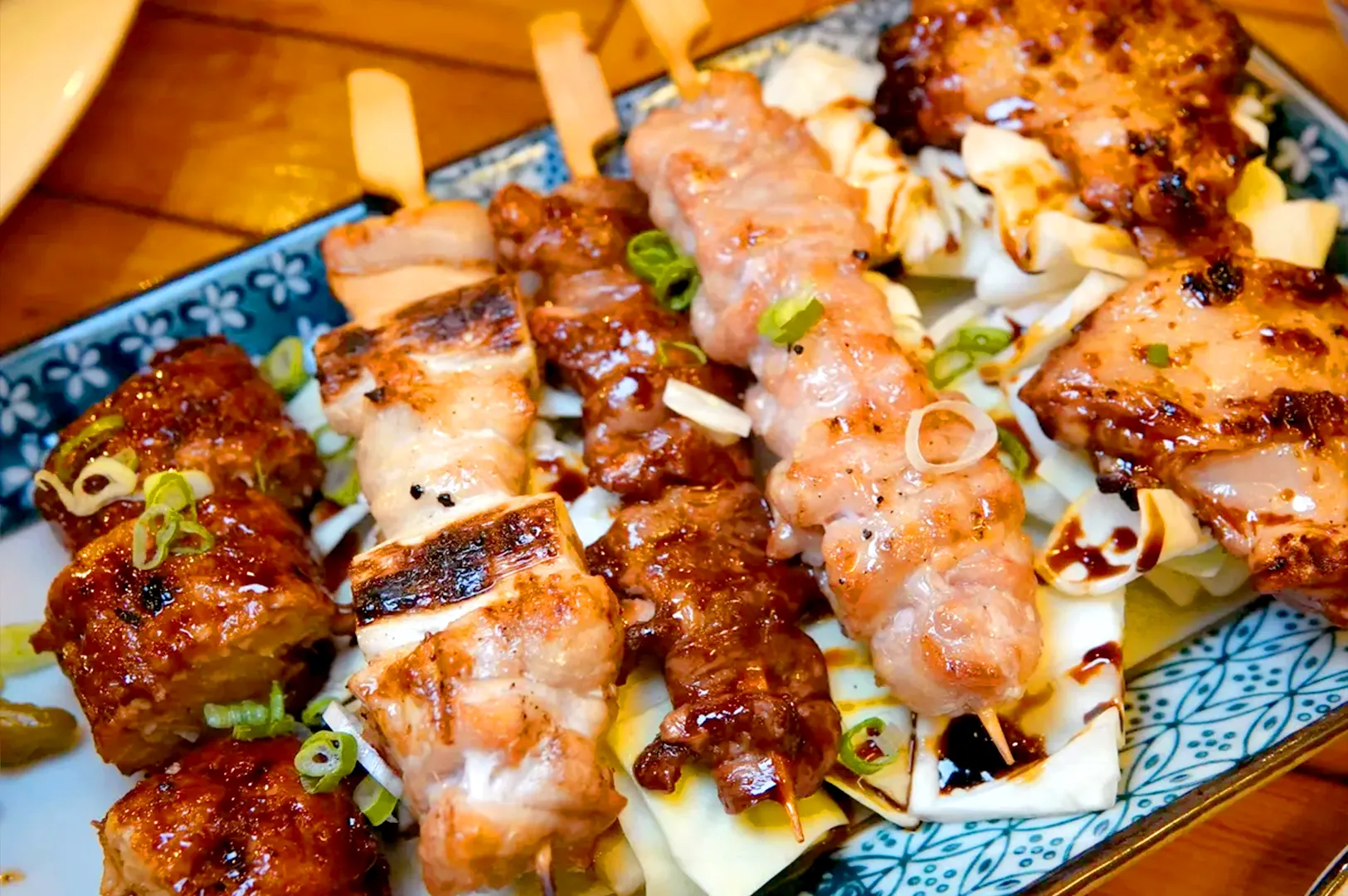 Kukai Izakaya yakitori skewers Singapore with grilled chicken, pork, and tare sauce at Orchard Towers izakaya