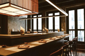 Modern Japanese handroll bar interior with counter seating and minimalist Tokyo-inspired dining space in Singapore CBD