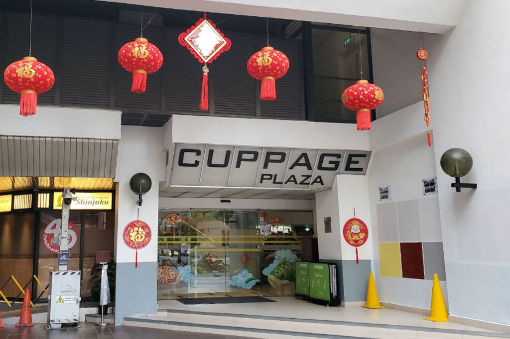 Cuppage Plaza entrance with festive lantern decorations in Orchard Singapore, known for Japanese restaurants and late-night izakaya dining scene