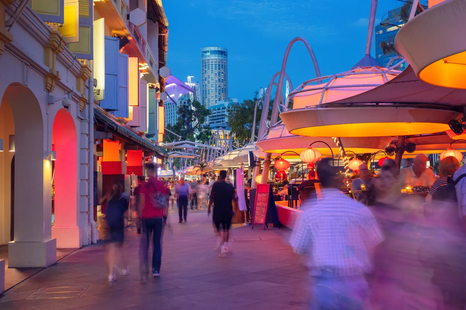 Clarke Quay riverside at dusk with diners