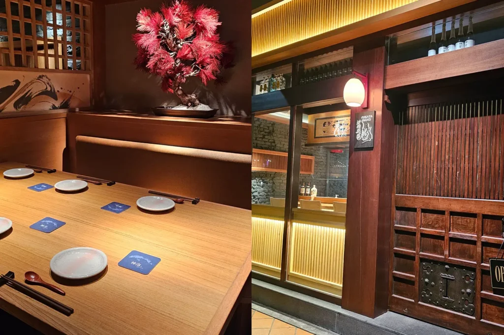 A warmly lit Japanese restaurant entryway with a wooden facade, red lantern, and narrow seating area.