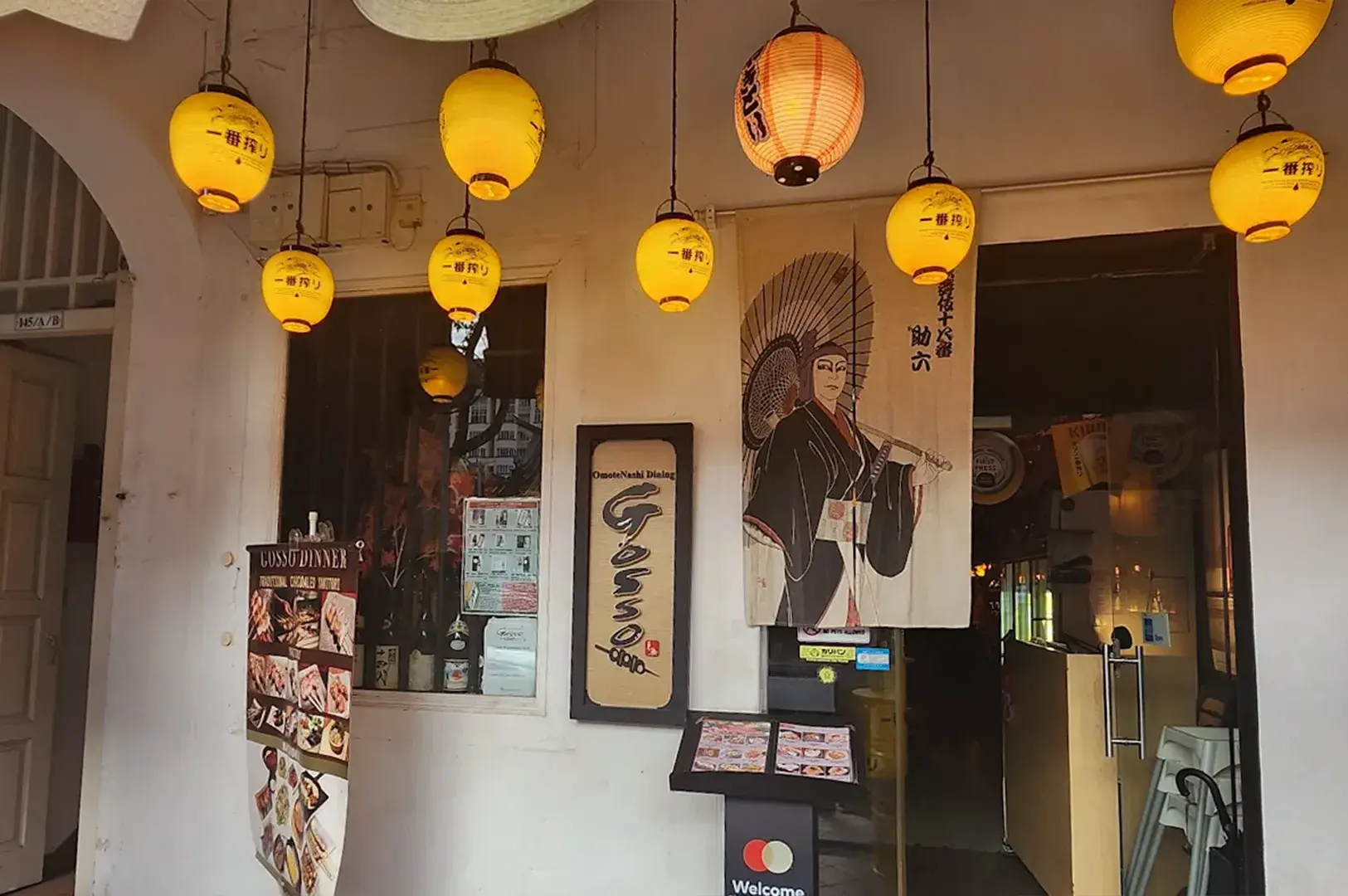 Yakitori Gosso restaurant entrance with hanging lanterns and Japanese signage.