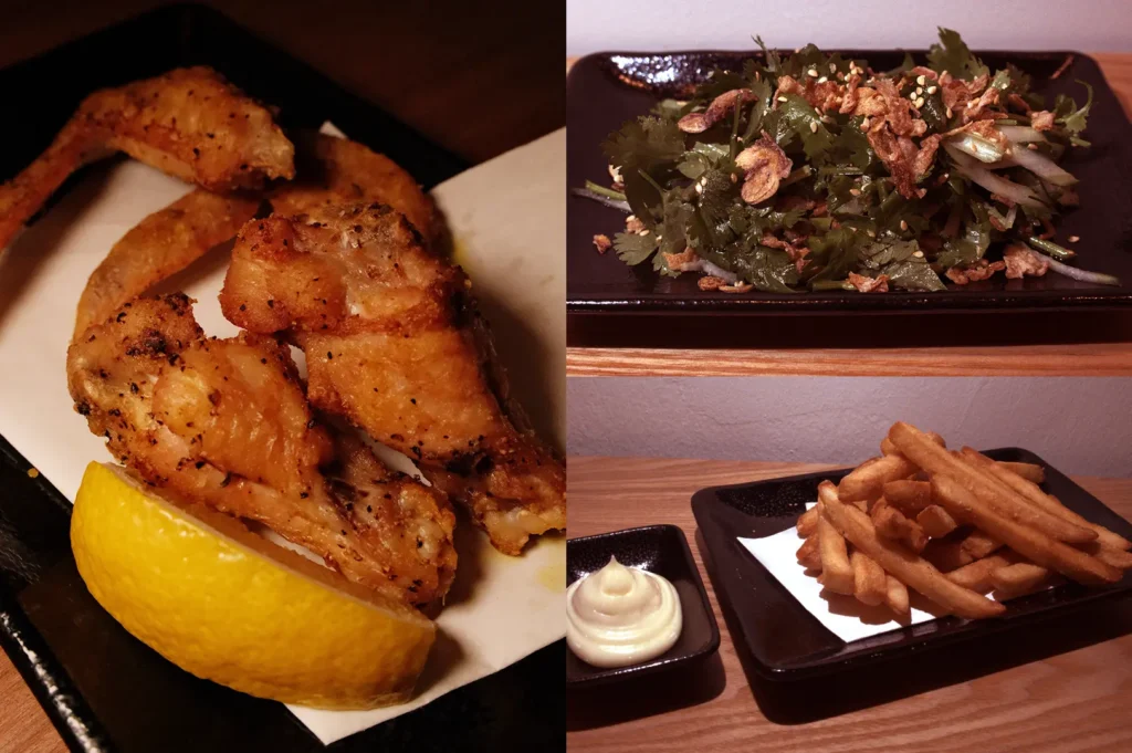 Food collage featuring grilled chicken wings with lemon, coriander salad topped with crispy onions, and crisp fries served with mayonnaise.